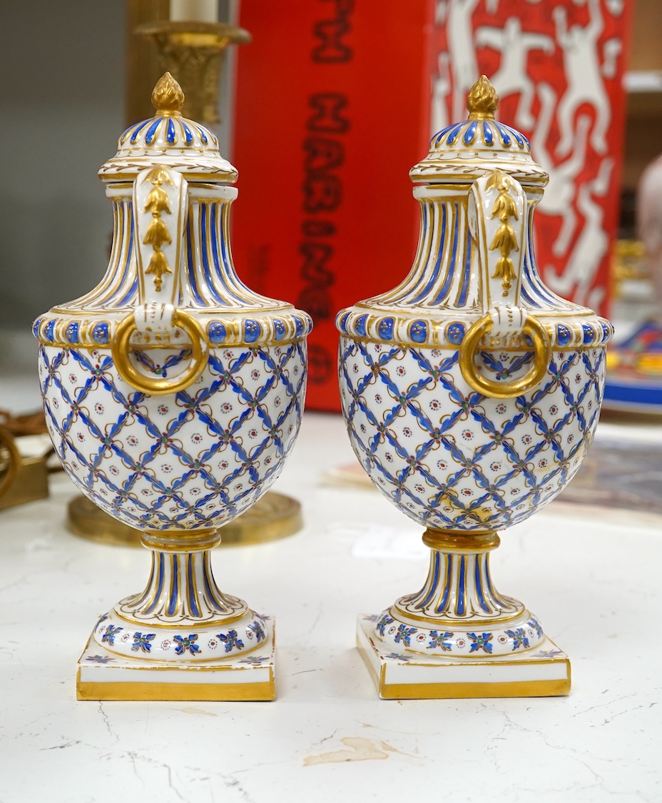 A pair of early 20th century Sevres style vases and covers, 21cm. Condition - good